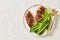 Seared chicken breasts with romaine lettuce leaves