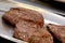 Seared fillets of beef steak resting after cooking