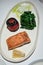 Seared Salmon Served with Roasted Tomato and Wilted Spinach. Healthy Lunch