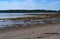 Sears Island in Searsport, Maine with a gravel beach in the foreground