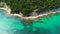 Seascape. Aerial view over sea and beach. Coast with stones and clear sand.