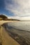 Seascape of the bay , with flock of swans, foggy sky and clear w