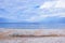 Seascape Beach Covered with Seashells  Shore Scenic Landscape Background Wallpaper Stock Photo