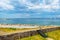 Seascape with a beautiful cloudy sky and a coastal line. Nature