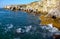 Seascape on the Black Sea, high steep stone coast with inaccessible rocks