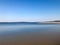 Seascape. Blue calm water and a piece of sushi against the blue sea, horizon