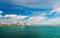 Seascape with bridge and buildings of miami usa on horizon. Skyscrapers of downtown district on cloudy sky. Architecture