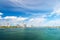 Seascape with bridge and buildings of miami usa on horizon. Skyscrapers of downtown district on cloudy sky. Architecture and desig