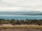 Seascape in Cabo de Hornos in Bulnes Fort, Punta Arenas, Chile with dry fields, trees, and mountain