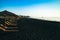 Seascape and Chaise lounges black beach of Kamari in Santorini