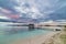 Seascape and cloudscape with jetty at dusk