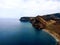 Seascape with coastal volcanic hills and blue wavy water in La Gomera, Canary Islands, Spain.