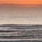 Seascape with colorful evening sky. isolated surfer on he sea