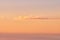 Seascape copy space with clouds in an orange sunset sky with a copyspace background. Calm, serene, tranquil, peaceful