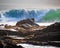 Seascape featuring waves crashing onto a rocky shore