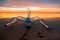 Seascape. Fisherman boat jukung. Traditional fishing boat at the beach during sunrise. Water reflection. Sanur beach, Bali,