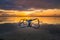 Seascape. Fisherman boat jukung. Traditional fishing boat at the beach during sunrise. Water reflection. Sanur beach, Bali,