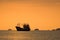 Seascape with fishing boat at sunset, Lipe island,