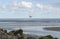 Seascape. Gull over the sea, the ship away