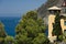 Seascape with house turret near the Cinque Terre. In the village of Framura a villa with a tower overlooking the blue sea and