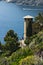 Seascape with house turret near the Cinque Terre. In the village of Framura a villa with a tower overlooking the blue sea and