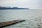 Seascape huge number of seagulls sit on old stone pier on background sea