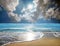 Seascape image of sandy beach and waves on shiny sea over sunny