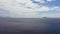 Seascape with islands in the distance. Blue sea and sky with clouds, view from the drone.