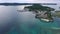 Seascape of Koror island in Palau. Boat and Cityscape, port, pier in Background