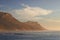 Seascape, landscape, scenic view of Hout Bay in Cape Town, South Africa at sunset. Blue ocean and sea with mountains in