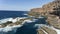 Seascape landscape with waves over rocks, cliff edge .