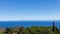 Seascape with a lighthouse in the foreground and Tuscany coastline on the horizon. Giglio Island Isola del Giglio, Tuscany,