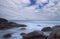 Seascape with long exposure with blue sky