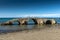 Seascape with medieval bridge in the water at Argassi beach, Zakynthos island