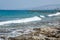 Seascape of the Mediterranean Sea with waves of the turquoise sea on the volcanic coast of Cyprus