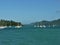 Seascape with mooring yachts, in the blurred background of the image Mountains,Whitsunday