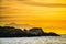 Seascape in the morning.  The colony of seals on the rocky island. South Africa.Seascape in the morning.  The colony of seals on