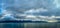 Seascape and mountain landscape on blue sky background in alaska