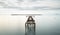 Seascape with old deserted industrial jetty at sunset. Abandoned damaged pier in the ocean