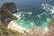 A seascape picturesque of Kelingking beach sea shore aqua water wave from the top in a beautiful sunny summer day in Nusa penida
