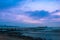 Seascape. Pier against the backdrop of sunset sky with beautiful clouds and sea waves. Anapa. Krasnodar Territory.