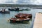 Seascape with pier, quiet sea harbor with clear transparent water and traditional greek fisher boats