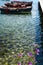 Seascape with pier, quiet sea harbor with clear transparent water and traditional greek fisher boats