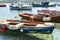 Seascape with pier, quiet sea harbor with clear transparent water and traditional greek fisher boats