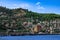 Seascape with Red Tower and Alanya Castle on top of a hill Turkey