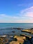 Seascape with rocks and concrete plates