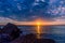 Seascape with rocks and nice sky in the summer season during the sunset