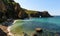 Seascape with a rocky coast. Diana`s grotto in the Crimea at dawn