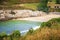 Seascape of romantic and small lapas beach in A Coruna, Galicia, Spain