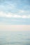 Seascape with sea horizon and blue sky. Background. Painterly seascape scene with relaxing sunset colours